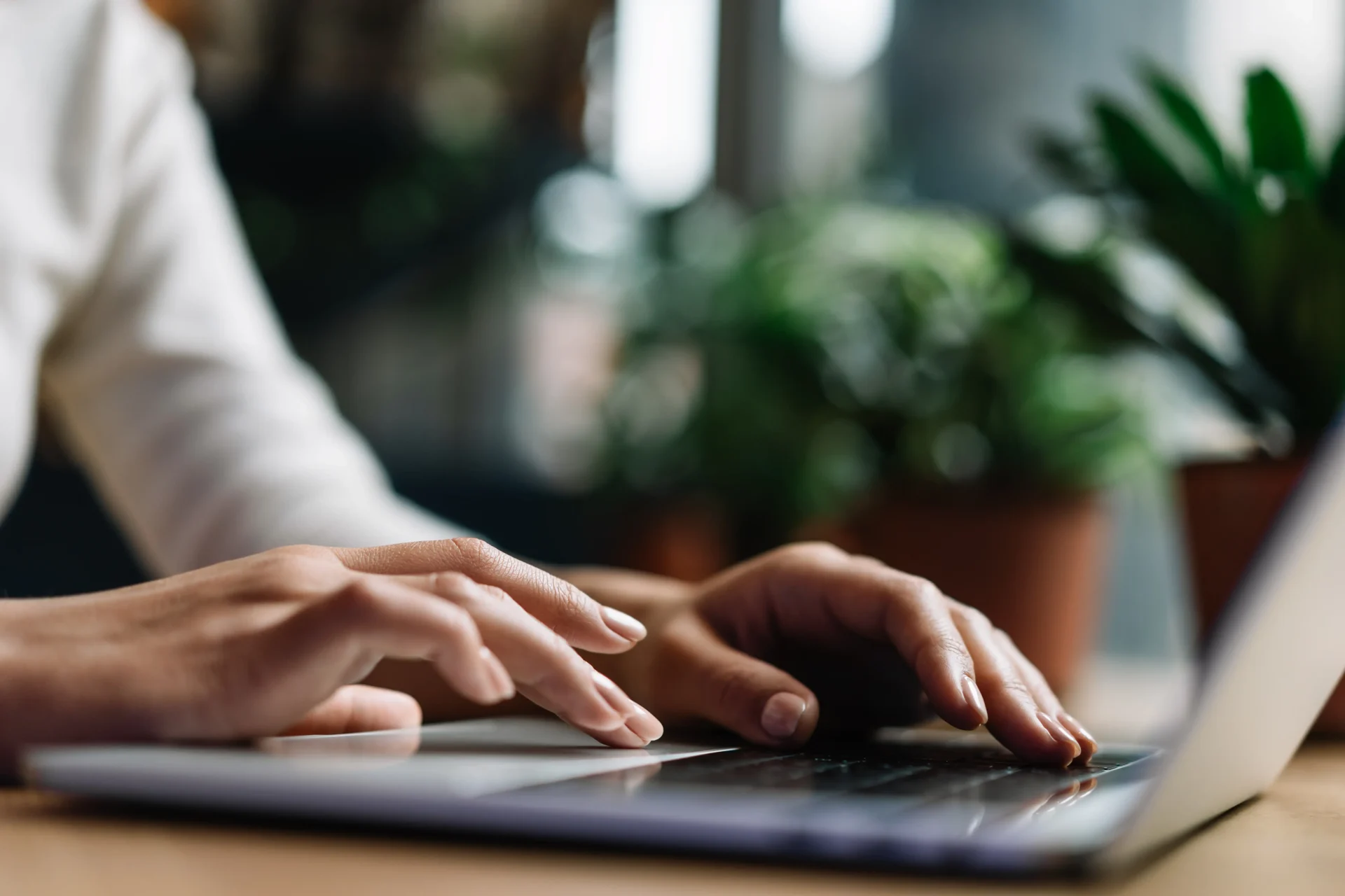 Hands typing on computer. Content on a website must be relevant and useful to a visitor. Copy text is important.