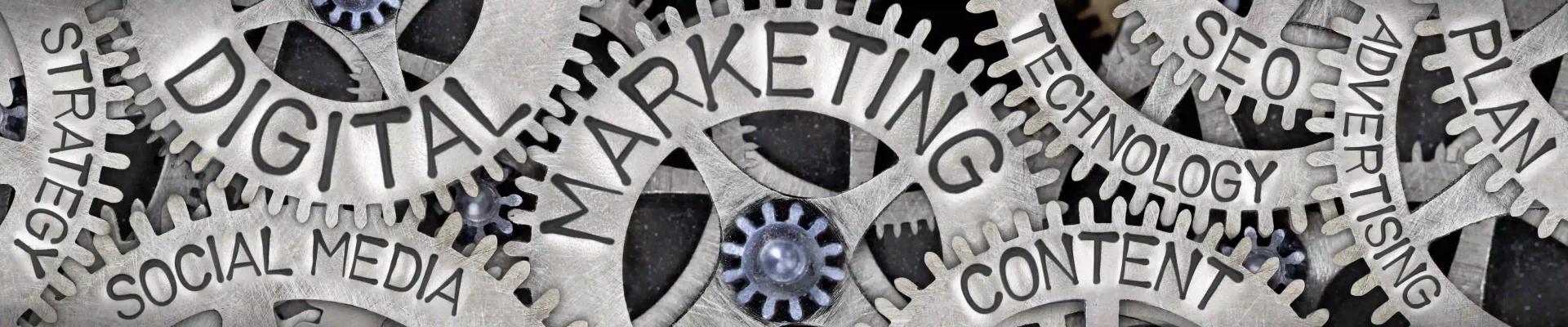 Close-up lots of gears with texts Strategy Social Media Digital Marketing Content Technology SEO Advertising Plan.