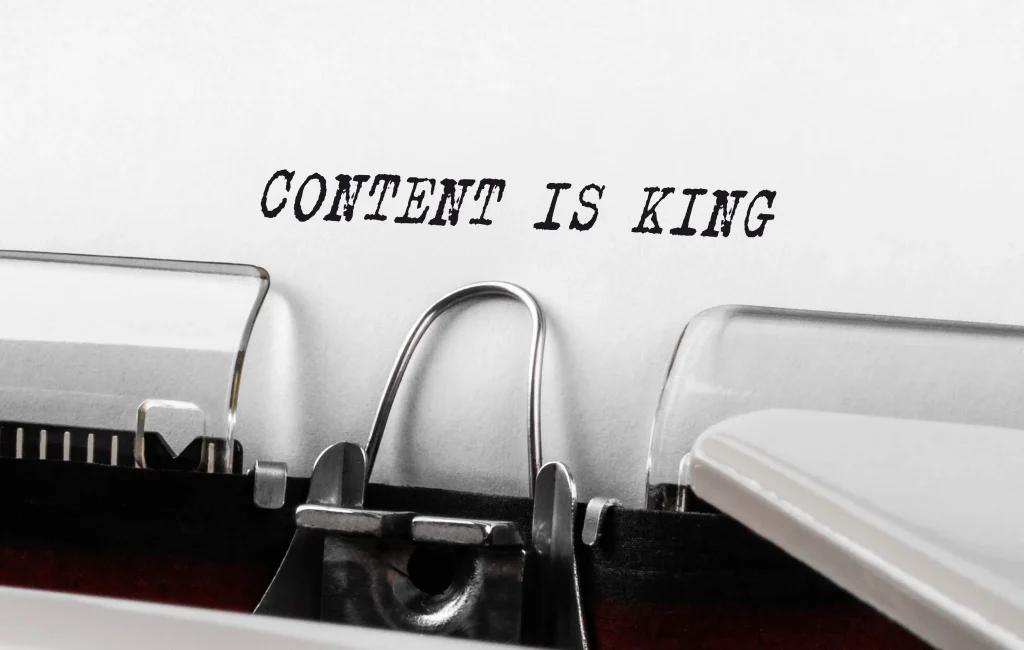 Content is king on a piece of paper in a typewriter. The content of a website should be the most valuable to a visitor.