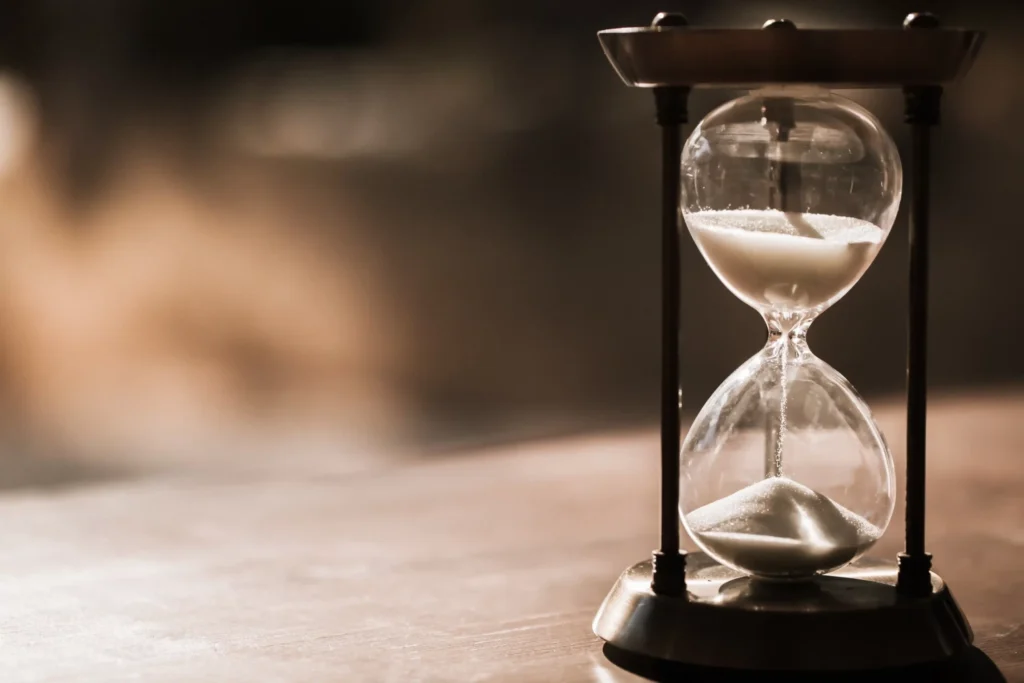 Hourglass with sand flowing, symbolizing time passing and the importance of speed and milliseconds in website performance.